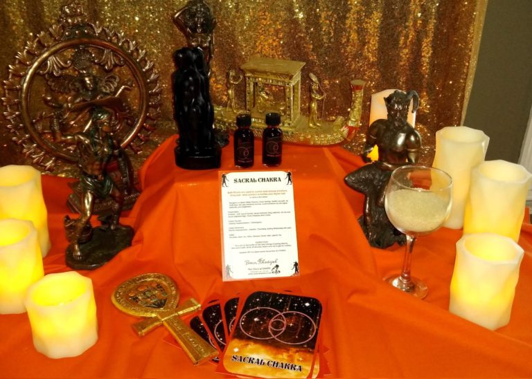 A table with candles, candles and other items on it.