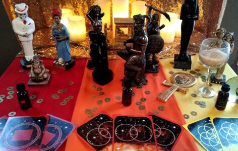 A table with various figurines and coins on it.