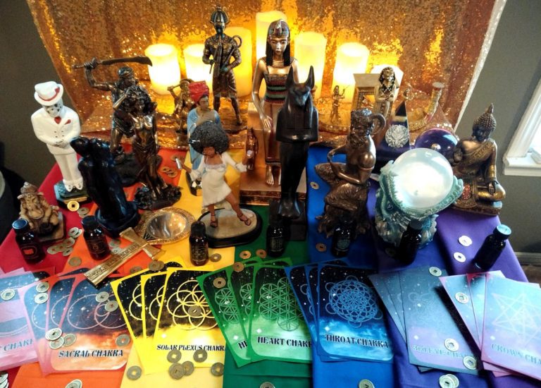 A table with many different colored cards and figurines